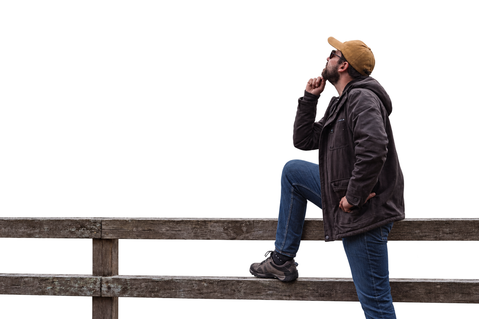 Lucas Pose sitting by a mountain lake